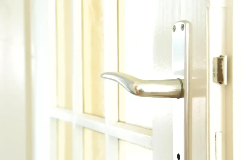 Lock repair or replacement in Bournemouth – white door with a lever handle and locking plate, Locksmith Bournemouth guide to which your door needs