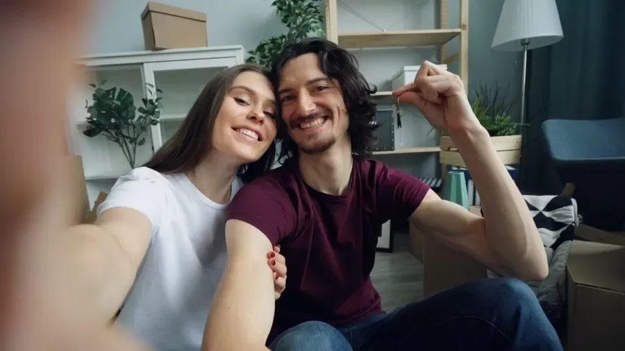 Couple holding up keys in their new home – residential locksmith Bournemouth help for homeowners from Locksmith Bournemouth