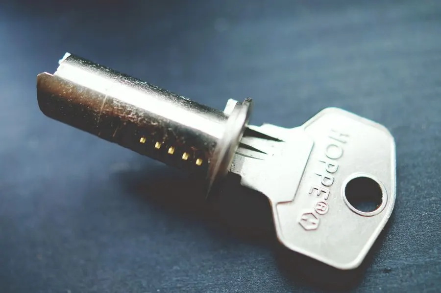 Euro cylinder lock and key on a dark surface