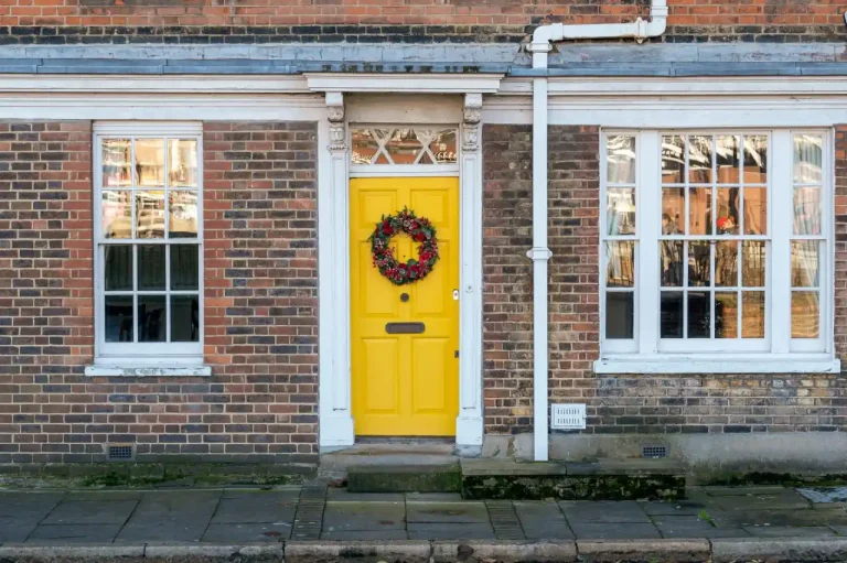 Types of door locks in the UK – yellow front door on a red-brick Victorian house in Bournemouth, Locksmith Bournemouth guide to identifying your lock
